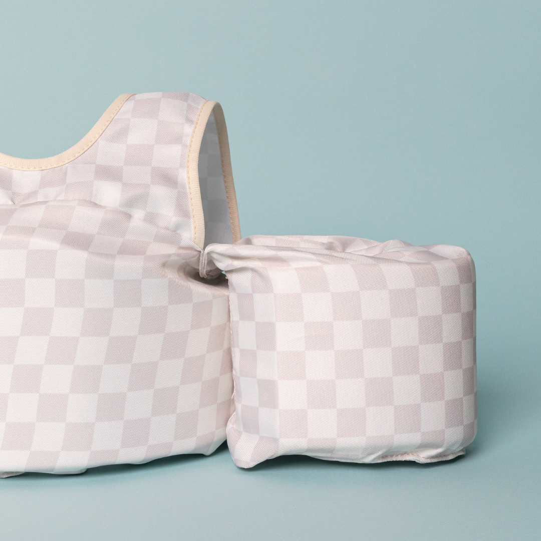 Close-up of Neutral Checkered Kids Float showing chest panel, shoulder strap and arm float