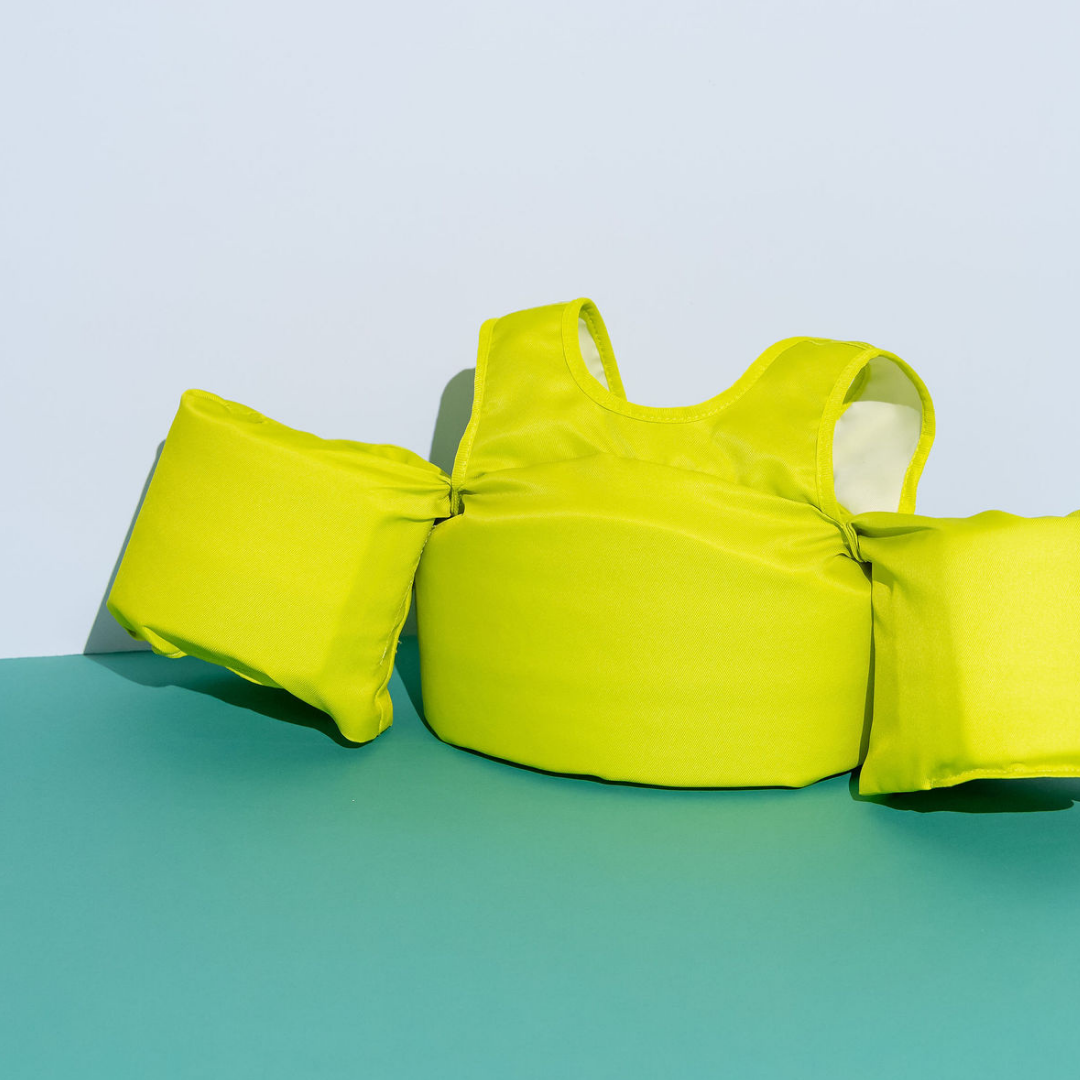 Lemon Lime kids swim float with arm wings on blue and green background