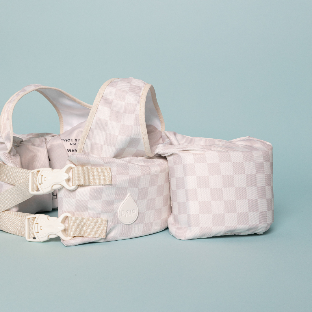 Back of Neutral Checkered Kids Float showing adjustable straps and secure double buckle system