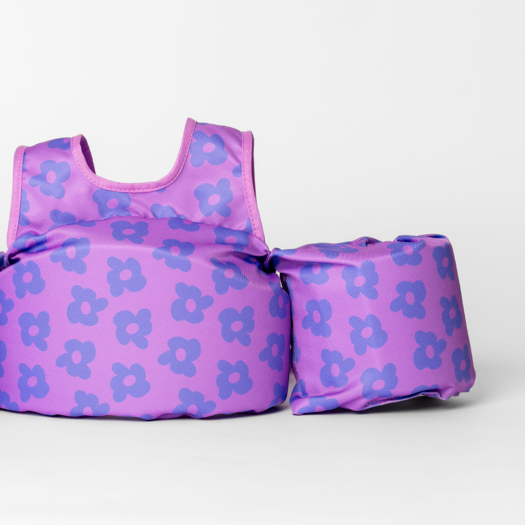 Close-up of Purple Flower Power kids swim float showing violet floral print and arm wing