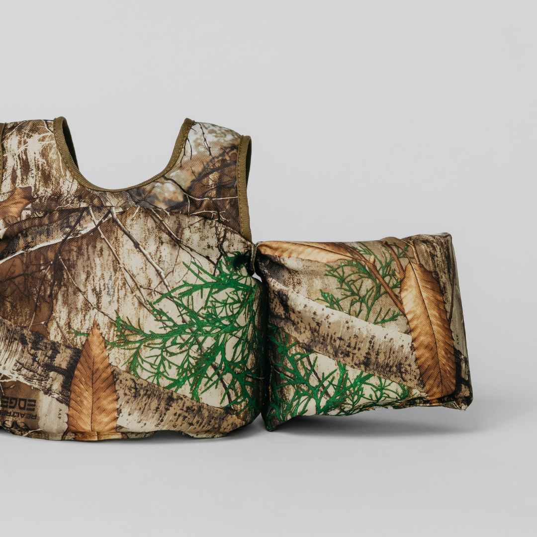 Close-up of Realtree Edge Camo Kids Float showing camouflage pattern and arm float