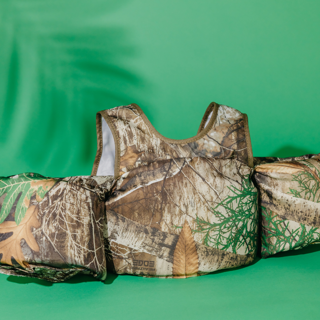 Realtree Edge Camo Kids Float with arm floats on green background