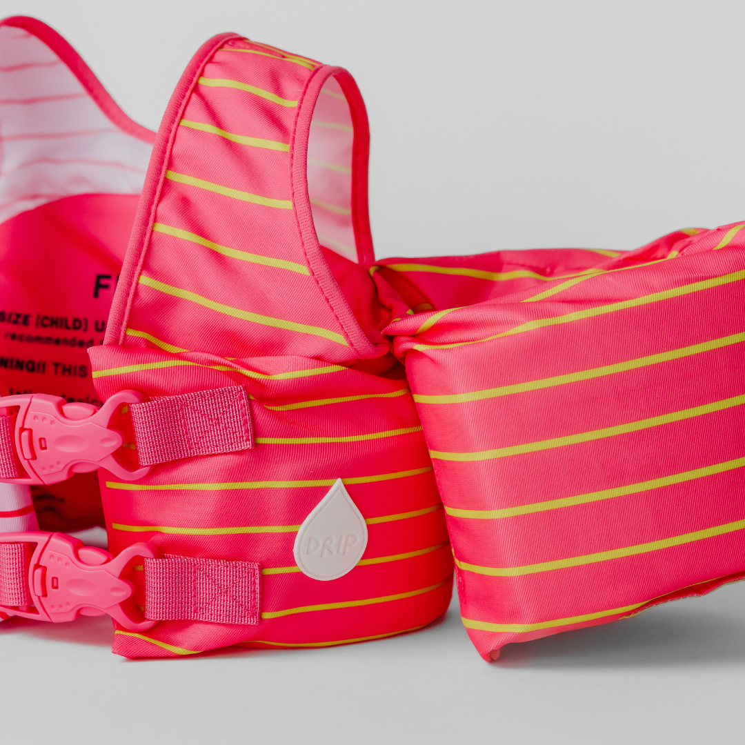 Pink Lemonade Stripe kids swim float with adjustable back buckles and shoulder straps