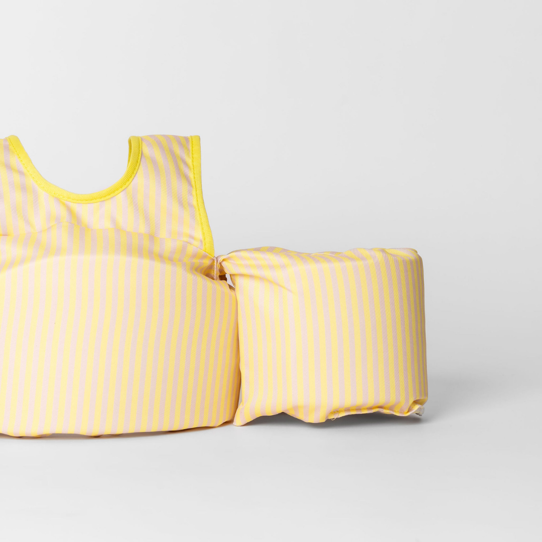 Close-up of Yellow Stripe kids swim float showing striped chest panel and arm wing